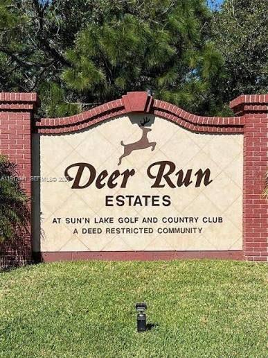 A brick-framed sign for Deer Run Estates stands in front of a grassy lawn — 4525 MAJORCA DR, Sebring FL 33872, SEBRING, FL