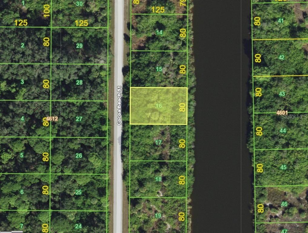 This is a map showing a highlighted rectangular land parcel adjacent to a road and canal — 10160 COCOA BEACH STREET, PORT CHARLOTTE, FL