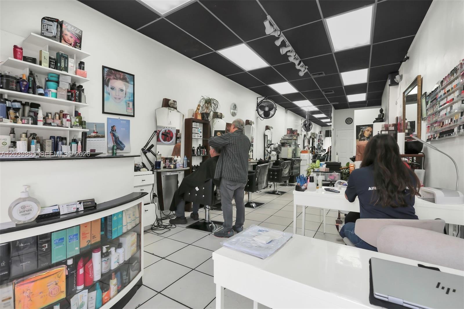 A hair salon features white walls, tiled floors, styling stations, and a black drop ceiling — 5233 NW 79th Ave, Doral FL 33166, DORAL, FL