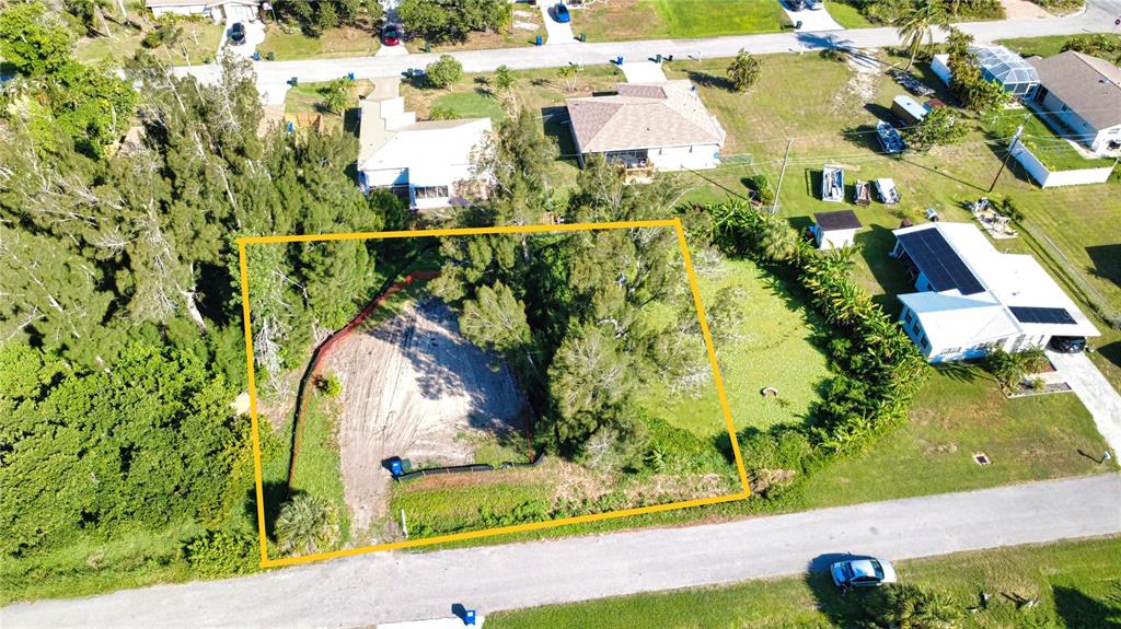 An aerial view shows a vacant, partially wooded residential lot outlined in yellow — 1020 LINDEN ROAD, VENICE, FL