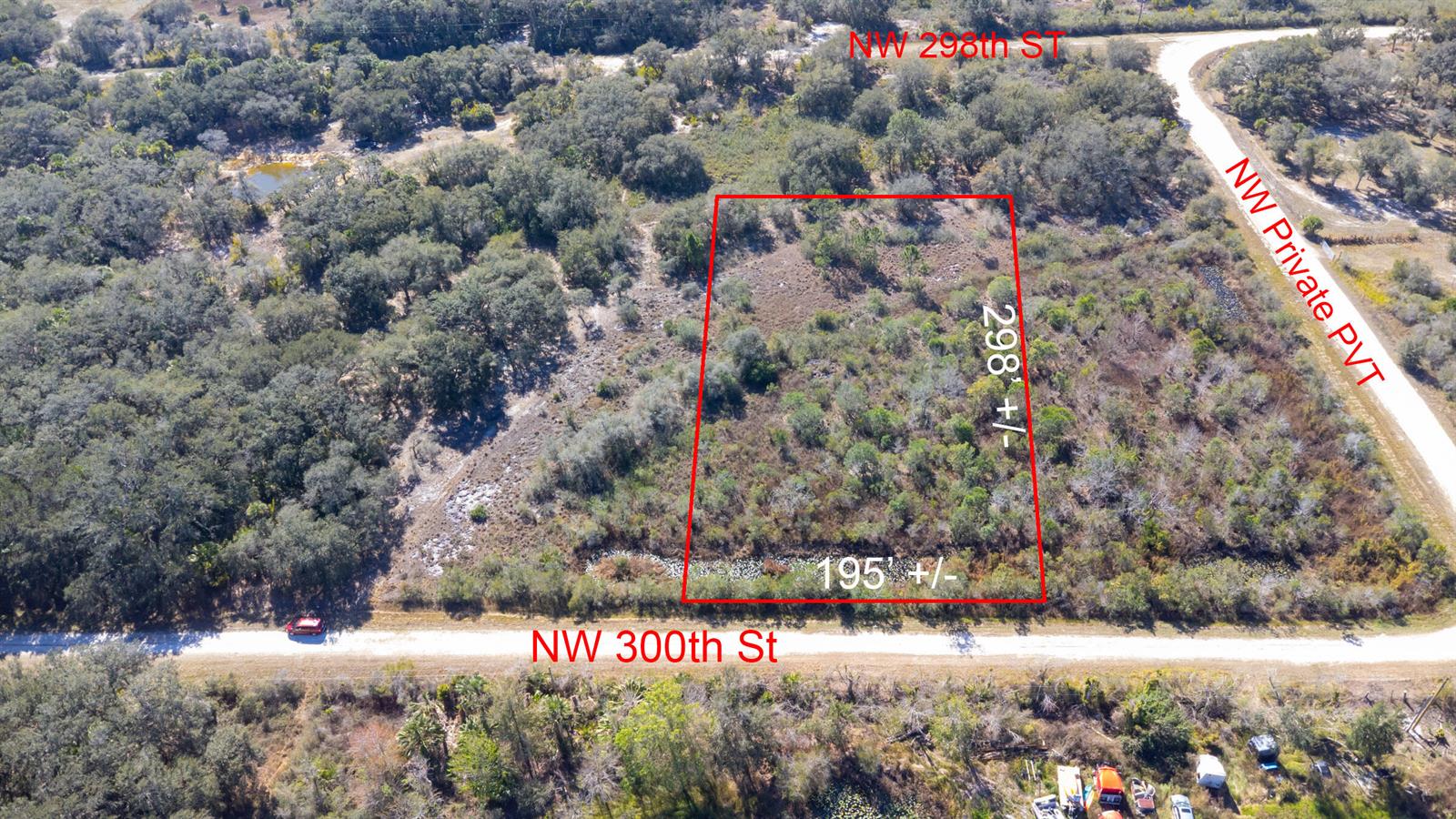 An aerial view shows a rectangular plot of land outlined in red near a road — 15686 NW 300th Street, Okeechobee FL 34972, OKEECHOBEE, FL