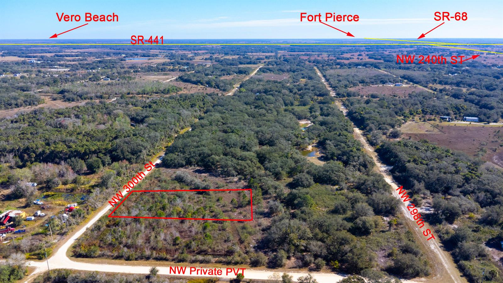 An aerial view shows a rectangular plot of land outlined in red near rural roads — 15686 NW 300th Street, Okeechobee FL 34972, OKEECHOBEE, FL