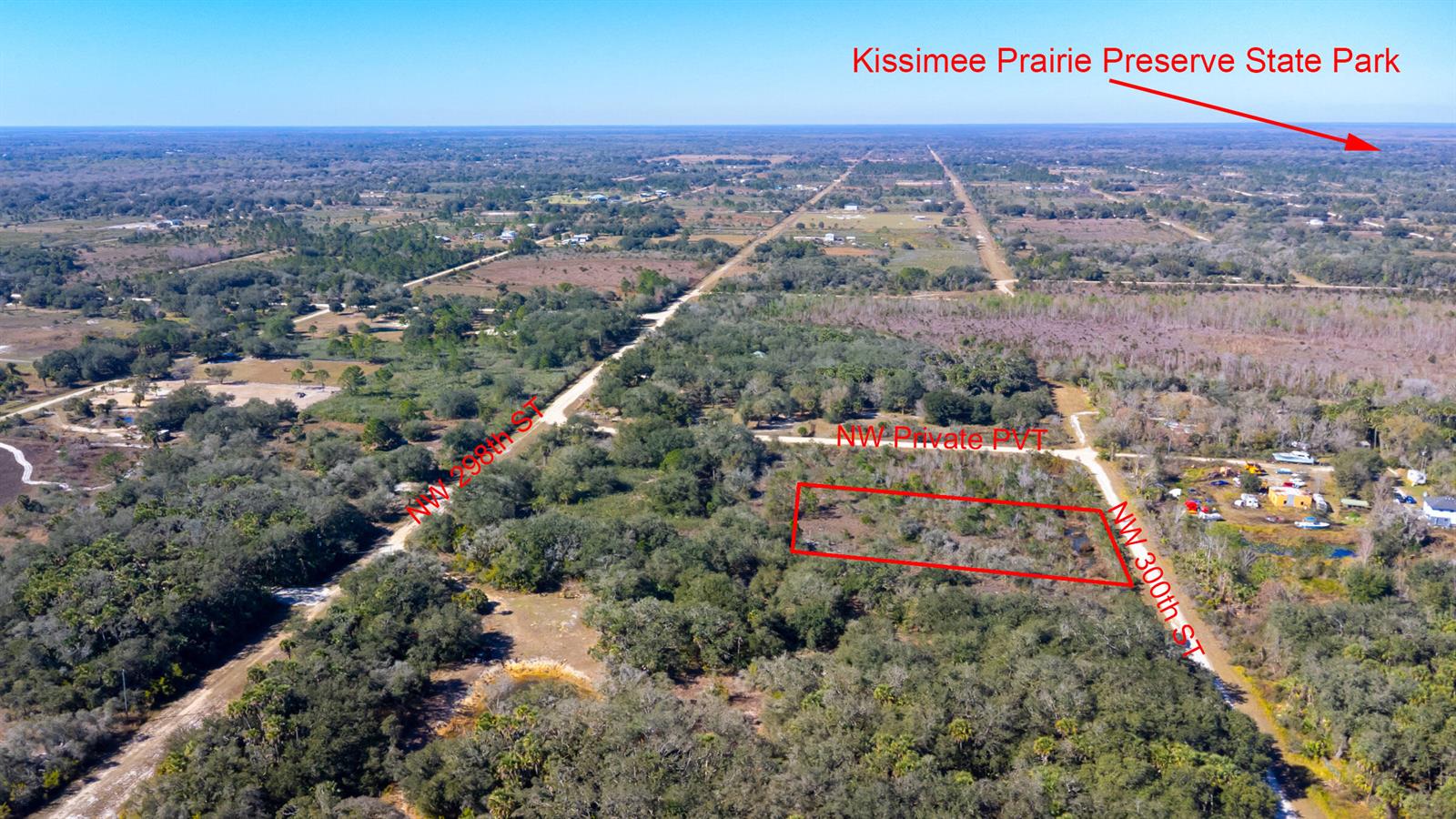 An aerial view shows a rectangular plot of land outlined in red near rural roads — 15686 NW 300th Street, Okeechobee FL 34972, OKEECHOBEE, FL