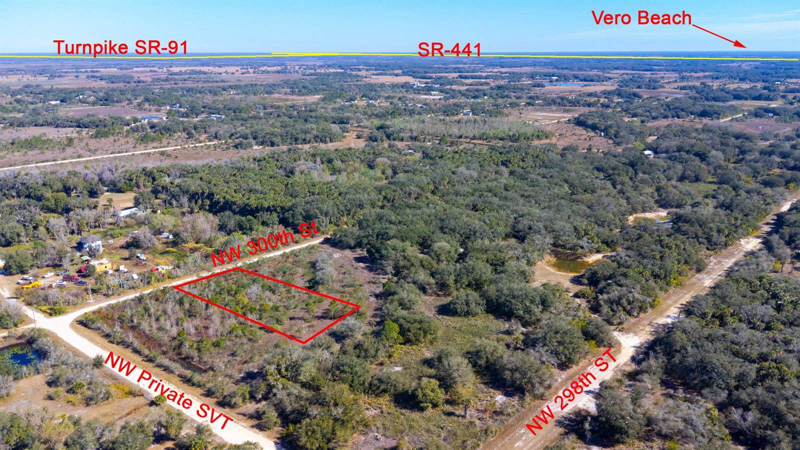 An aerial view shows a rectangular plot of land outlined in red near rural roads — 15686 NW 300th Street, Okeechobee FL 34972, OKEECHOBEE, FL