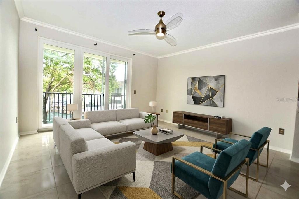 A living room features a light gray sofa, two teal armchairs, and a sliding glass door — 858 NORMANDY TRACE ROAD, TAMPA, FL