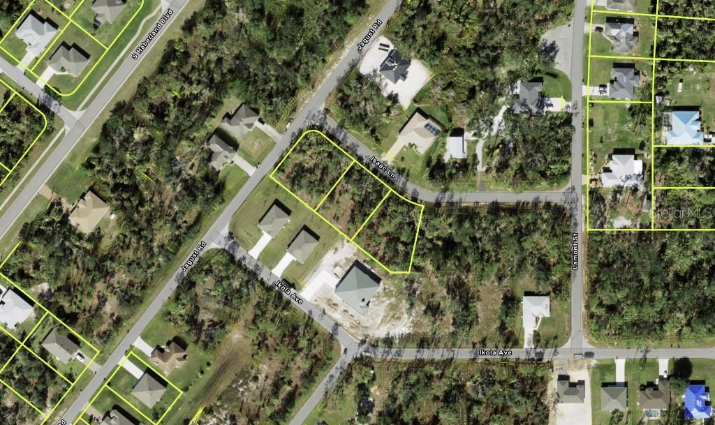 This aerial map shows several vacant residential lots and existing houses near intersecting paved roads — ISAAC LANE, NORTH PORT, FL