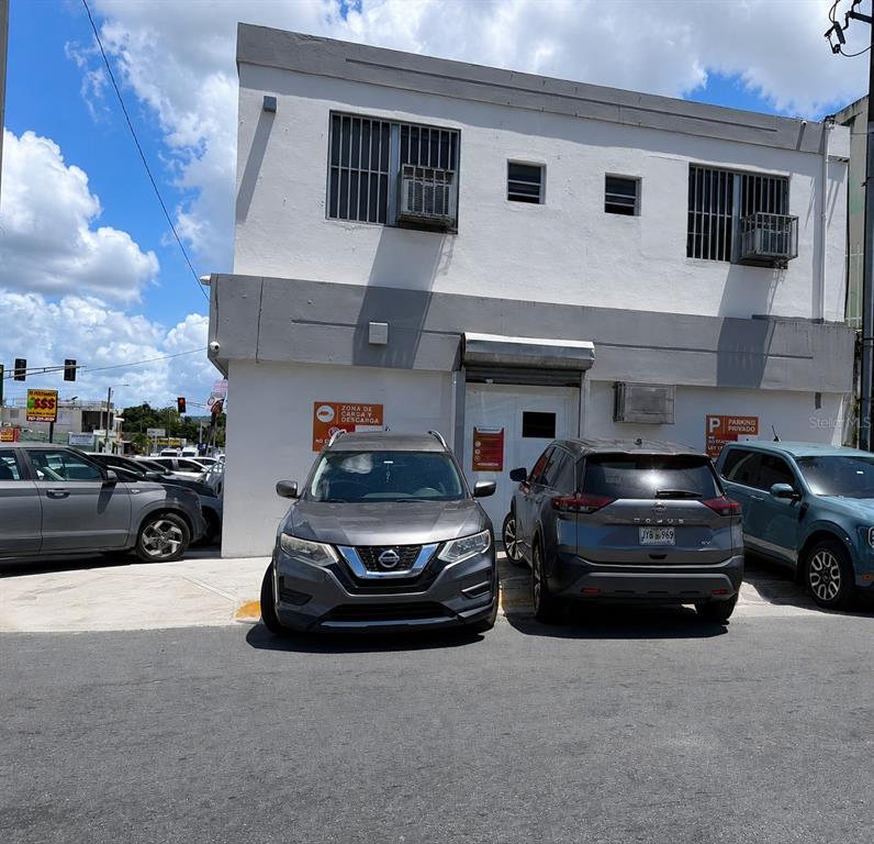 A two-story white commercial building with several cars parked in front — Calle 30 CAPARRA TERRACE SO1300, CAPARRA TERRACE, PR