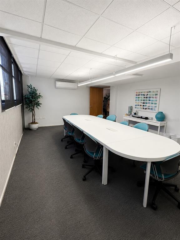 A conference room features a long white table, blue chairs, and a drop ceiling — Calle 30 CAPARRA TERRACE SO1300, CAPARRA TERRACE, PR