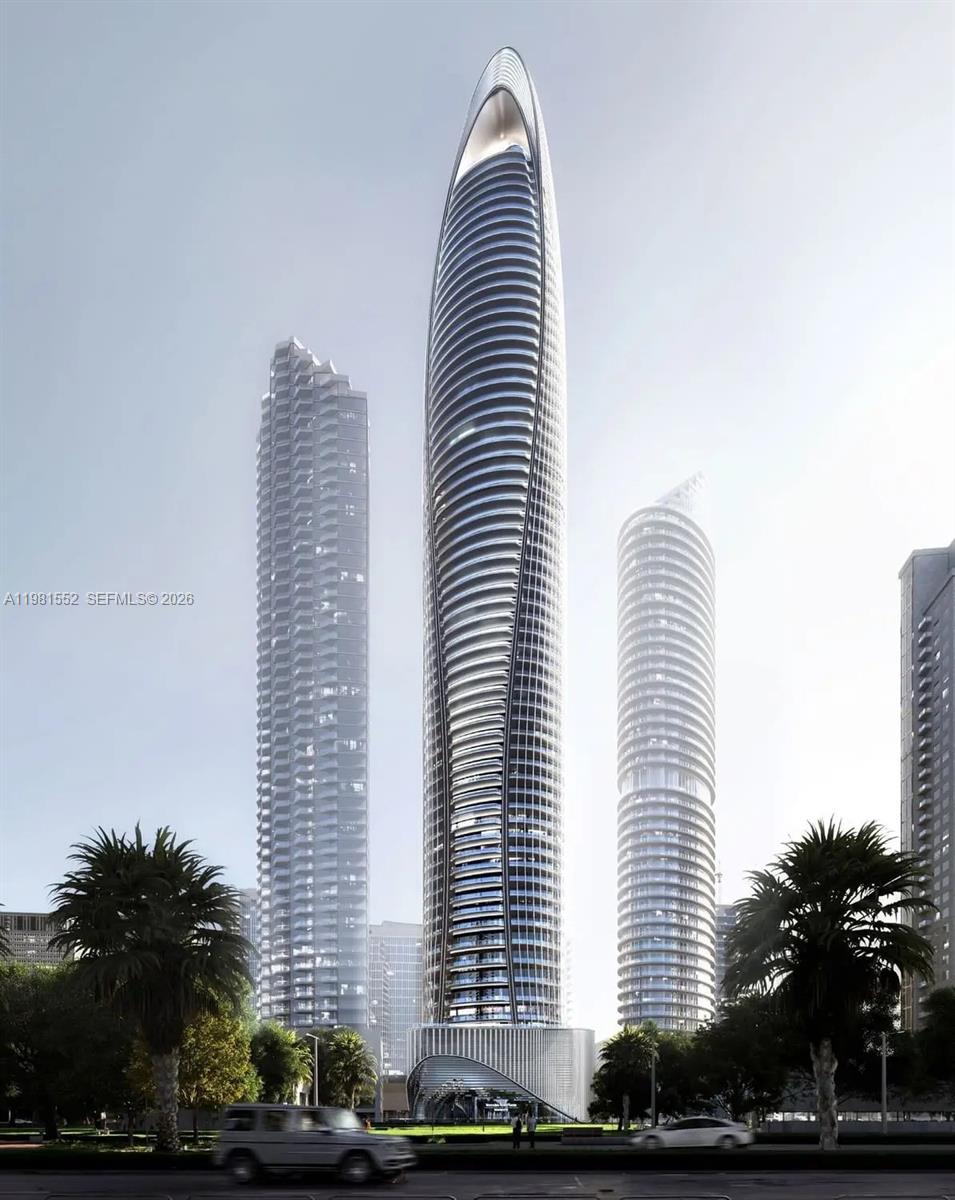 This is a rendering of a tall, modern, curved skyscraper surrounded by other high-rise buildings — 284033 Al Asayel Street # 0, Dubai, FL