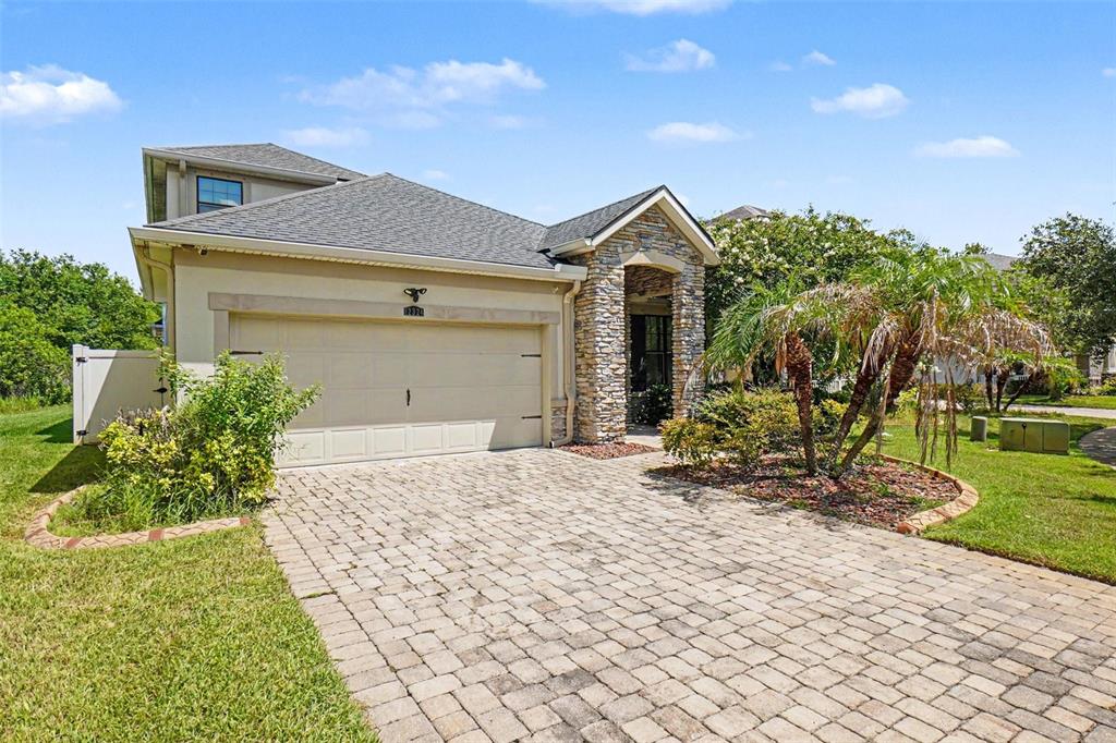 A room with light wood-look flooring, white walls, a ceiling fan, and a window with curtains — 12324 STREAMBED DRIVE, RIVERVIEW, FL