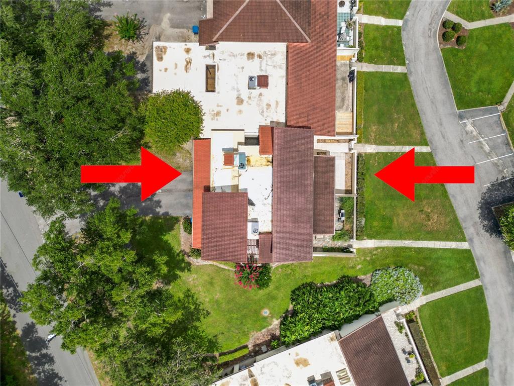 A two-story house with a brown tile roof and a front lawn with walkways — 7 LOMA LINDA UNIT 7, LAKELAND, FL
