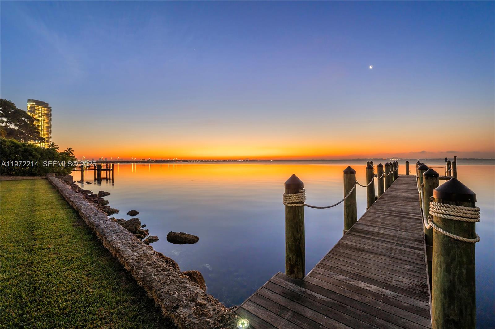 A wooden dock extends into a calm body of water at sunset — 3149 Brickell Ave, Miami FL 33129, MIAMI, FL