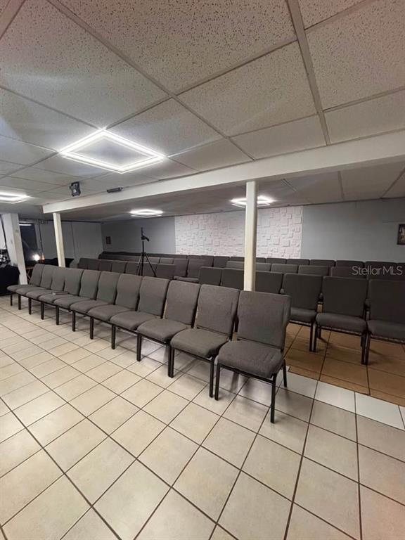 A room with rows of gray chairs, a tiled floor, and a drop ceiling — 22 URB. RIVERVIEW AA1, CALLE 22, BAYAMON, PR