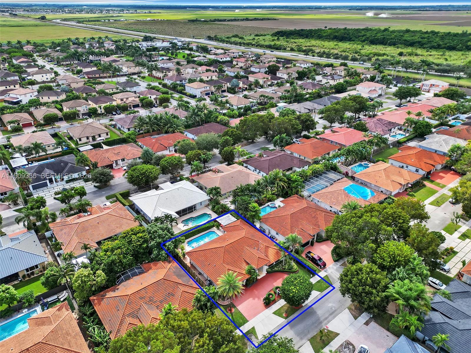 An aerial view shows a residential house with a red tile roof and swimming pool — 15462 SW 115th St, Miami FL 33196, MIAMI, FL