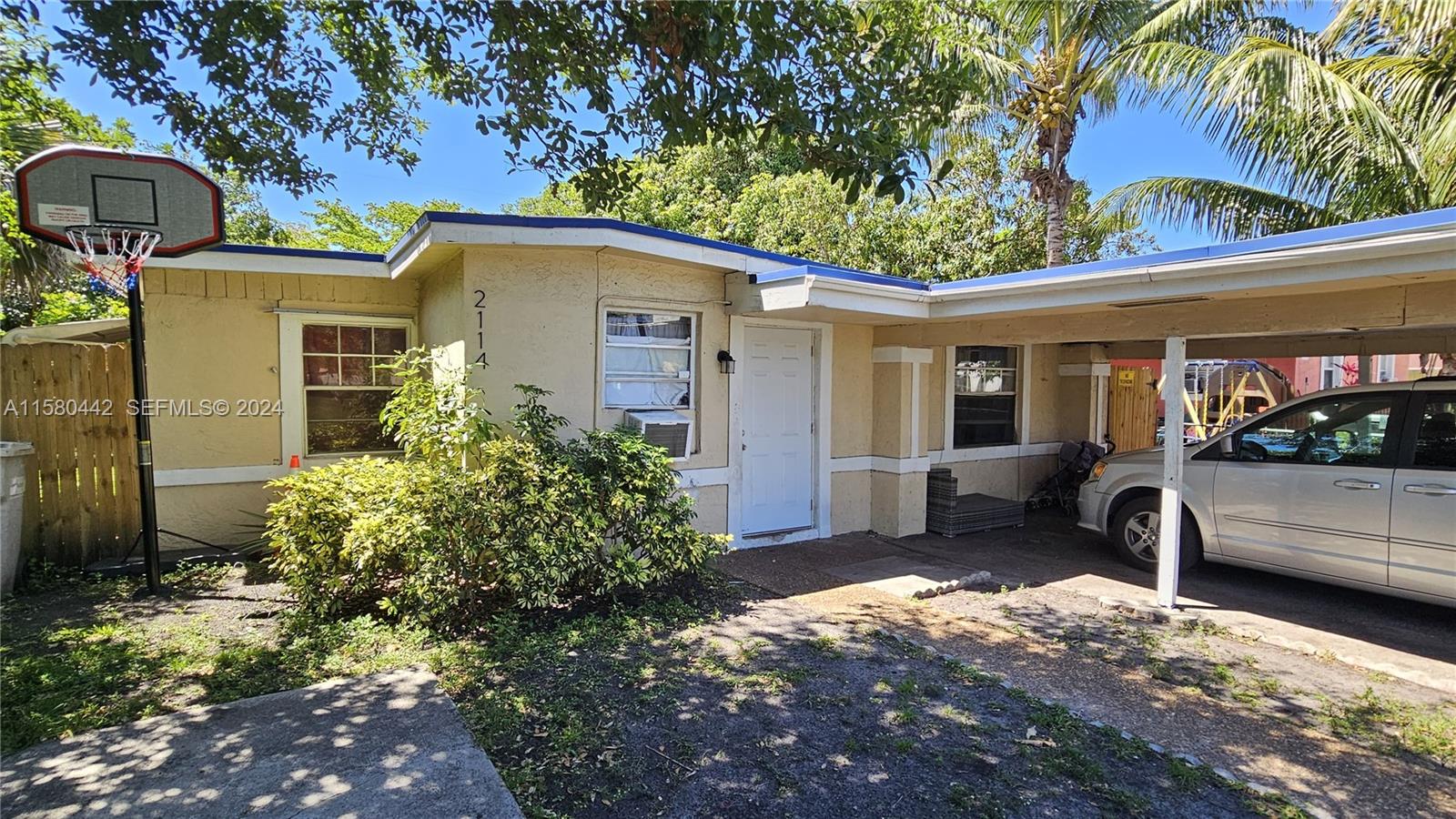 A single-story house with a carport, a basketball hoop, and a small front yard — 2114 NW 5th St, Pompano Beach FL 33069, POMPANO BEACH, FL