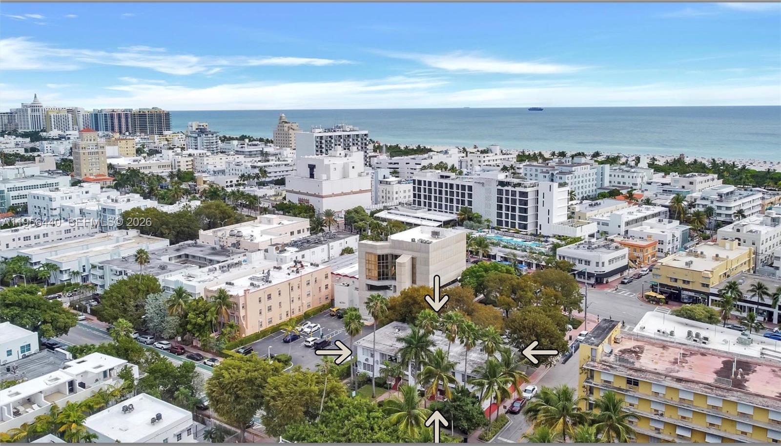An aerial view of a low-rise building surrounded by palm trees in a coastal city — 901 Pennsylvania Ave, Miami Beach FL 33139, MIAMI BEACH, FL