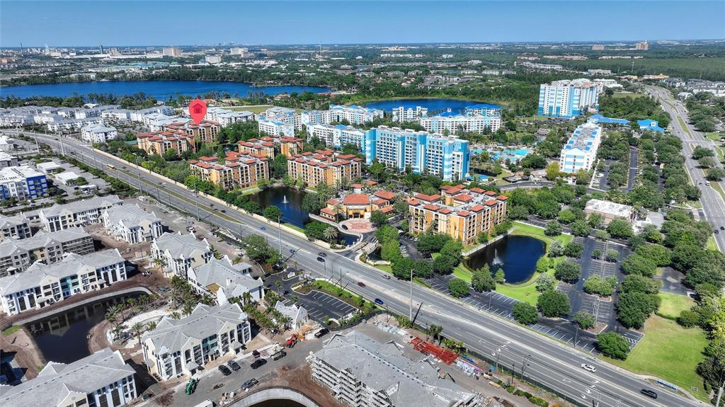 An aerial view shows a multi-story apartment complex with a red location pin — 12539 FLORIDAYS RESORT DRIVE UNIT 211D, ORLANDO, FL