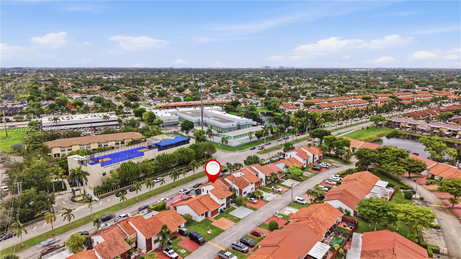 An aerial view shows a residential neighborhood with red-tiled roofs and a marked property — 13523 SW 59th Ter, Miami FL 33183, MIAMI, FL