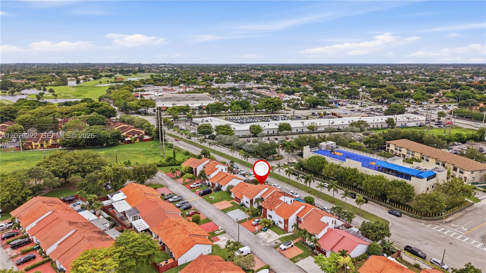 An aerial view shows a residential neighborhood with red-tiled roofs and a nearby school — 13523 SW 59th Ter, Miami FL 33183, MIAMI, FL