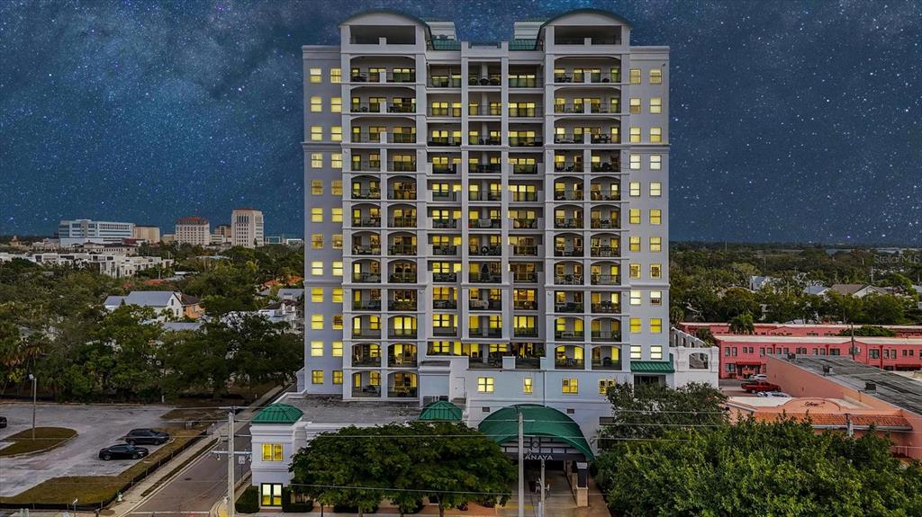 An aerial view of a city skyline with high-rise buildings at sunset near the water — 505 S ORANGE AVENUE UNIT 301, SARASOTA, FL