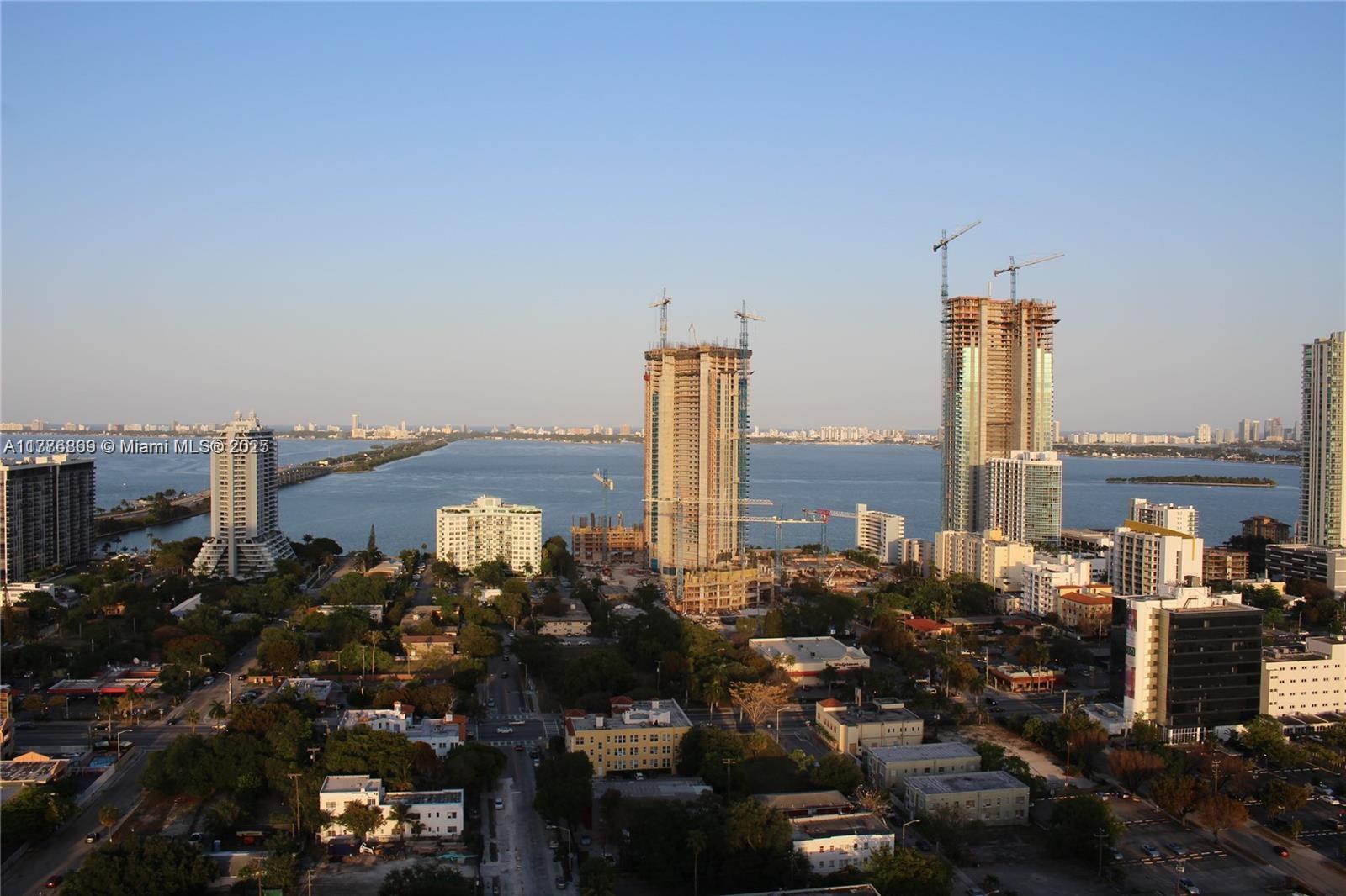 An elevated view shows a coastal city skyline with several high-rise buildings under construction — 3301 NE 1 AV # H2904, Miami FL 33137, MIAMI, FL