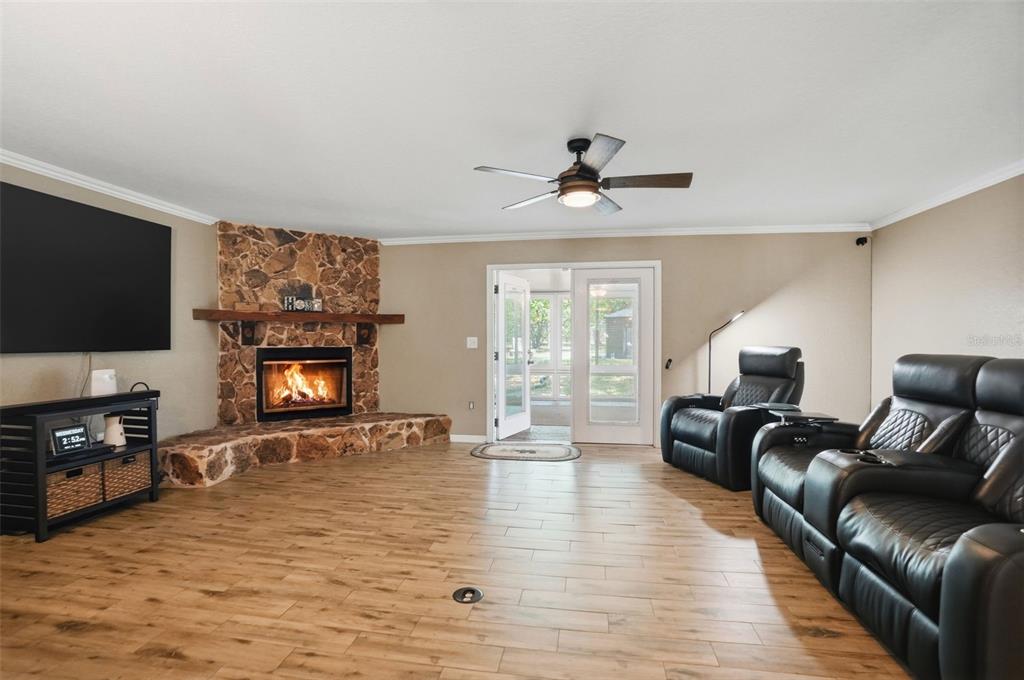 A single-story mobile home with light green siding and a small set of front steps — 15620 HAYS ROAD, SPRING HILL, FL