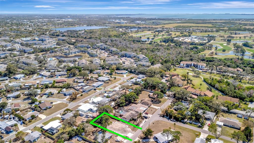An aerial view shows a vacant residential lot outlined in green within a suburban neighborhood — 4519 60TH STREET W, BRADENTON, FL