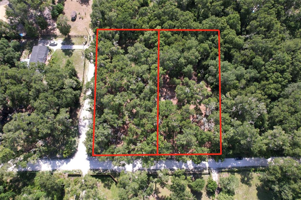 An aerial view shows two adjacent, wooded rectangular lots outlined in red along a road — 17792 SE 30TH AVENUE, SUMMERFIELD, FL