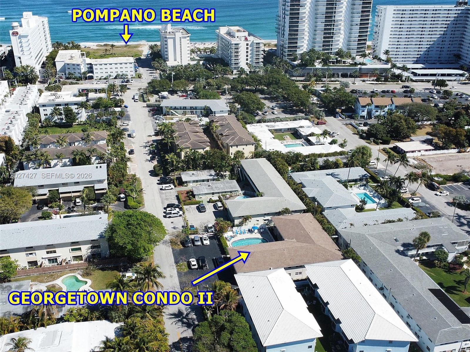 Aerial view of a residential complex with a pool near Pompano Beach — POMPANO BEACH, FL