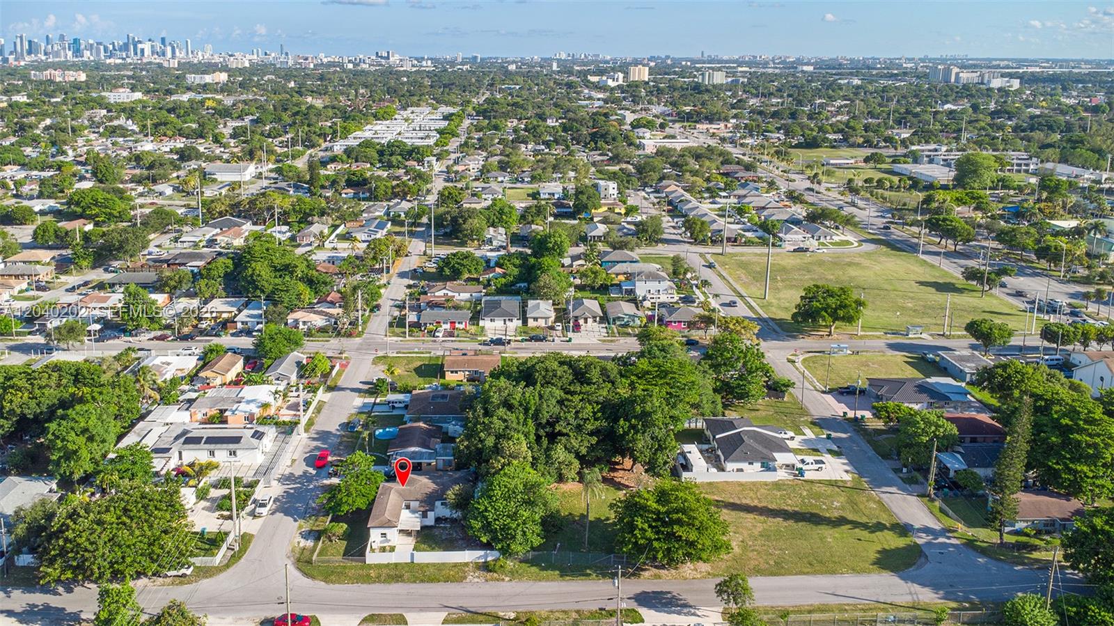 An aerial view shows a residential neighborhood with a marked house and surrounding trees — 7190 NW 21st Ave, Miami FL 33147, MIAMI, FL