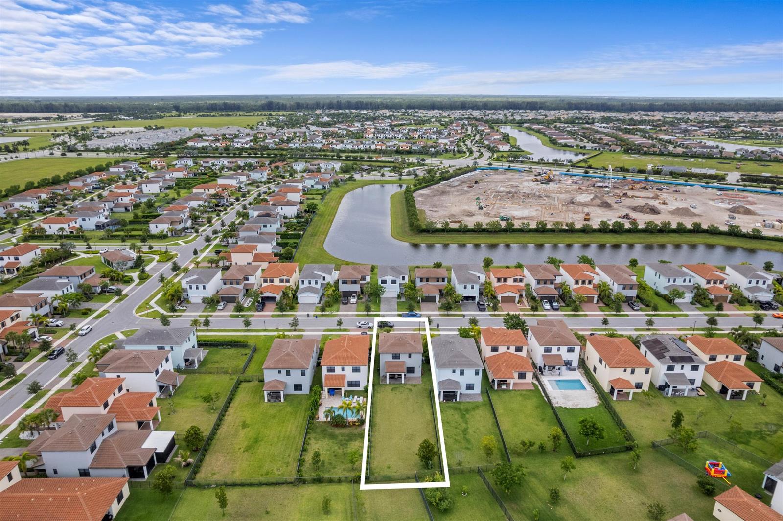 An aerial view of a residential neighborhood highlighting a single house with a large backyard — 16169 Sea Turtle Place, Westlake FL 33470, WESTLAKE, FL