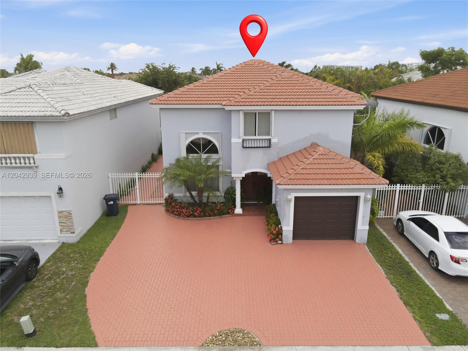An aerial view shows a two-story house with a tiled roof and a paved driveway — 15652 SW 91st Ln, Miami FL 33196, MIAMI, FL