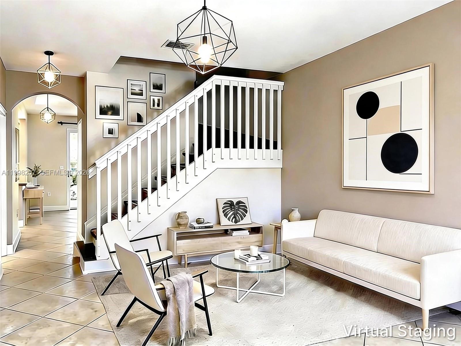 A tiled entryway features a white staircase with a wooden railing and a ceiling fan — 3377 Merrick Ln # 707, Margate FL 33063, MARGATE, FL