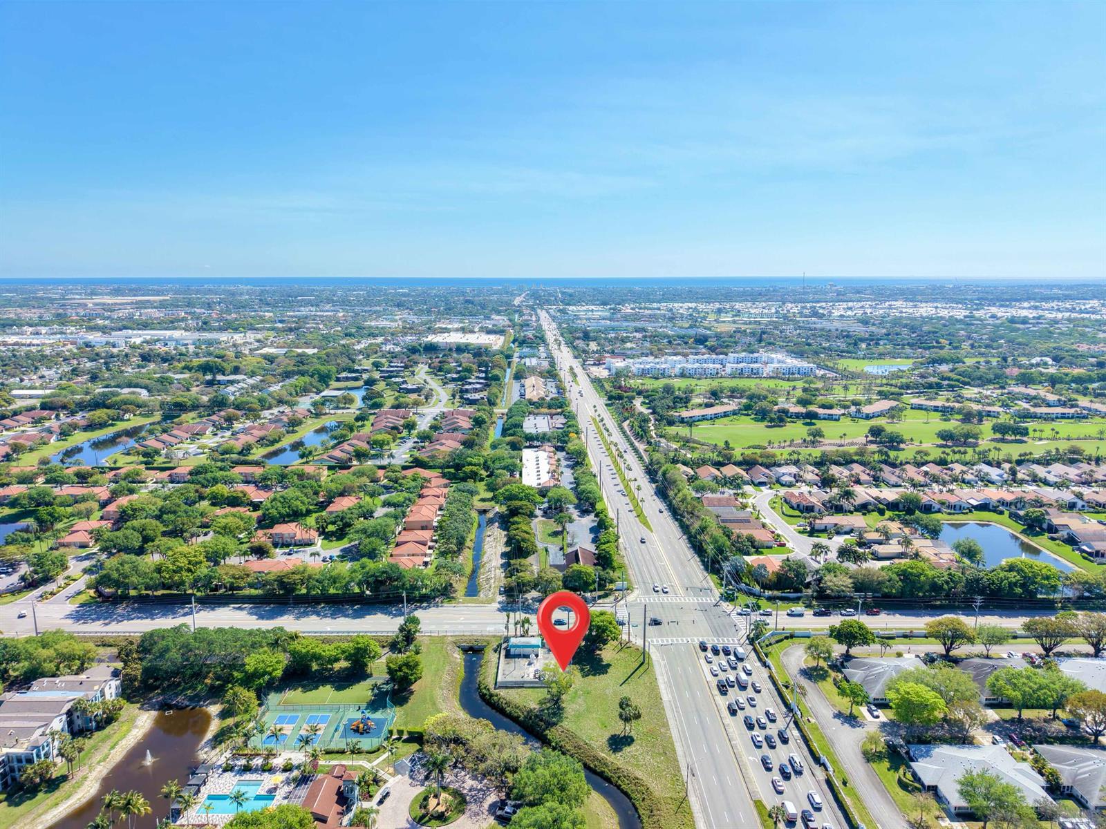 An aerial view shows a small building marked with a red pin near a highway — Xxxx Lawrence Road, Boynton Beach FL 33436, BOYNTON BEACH, FL