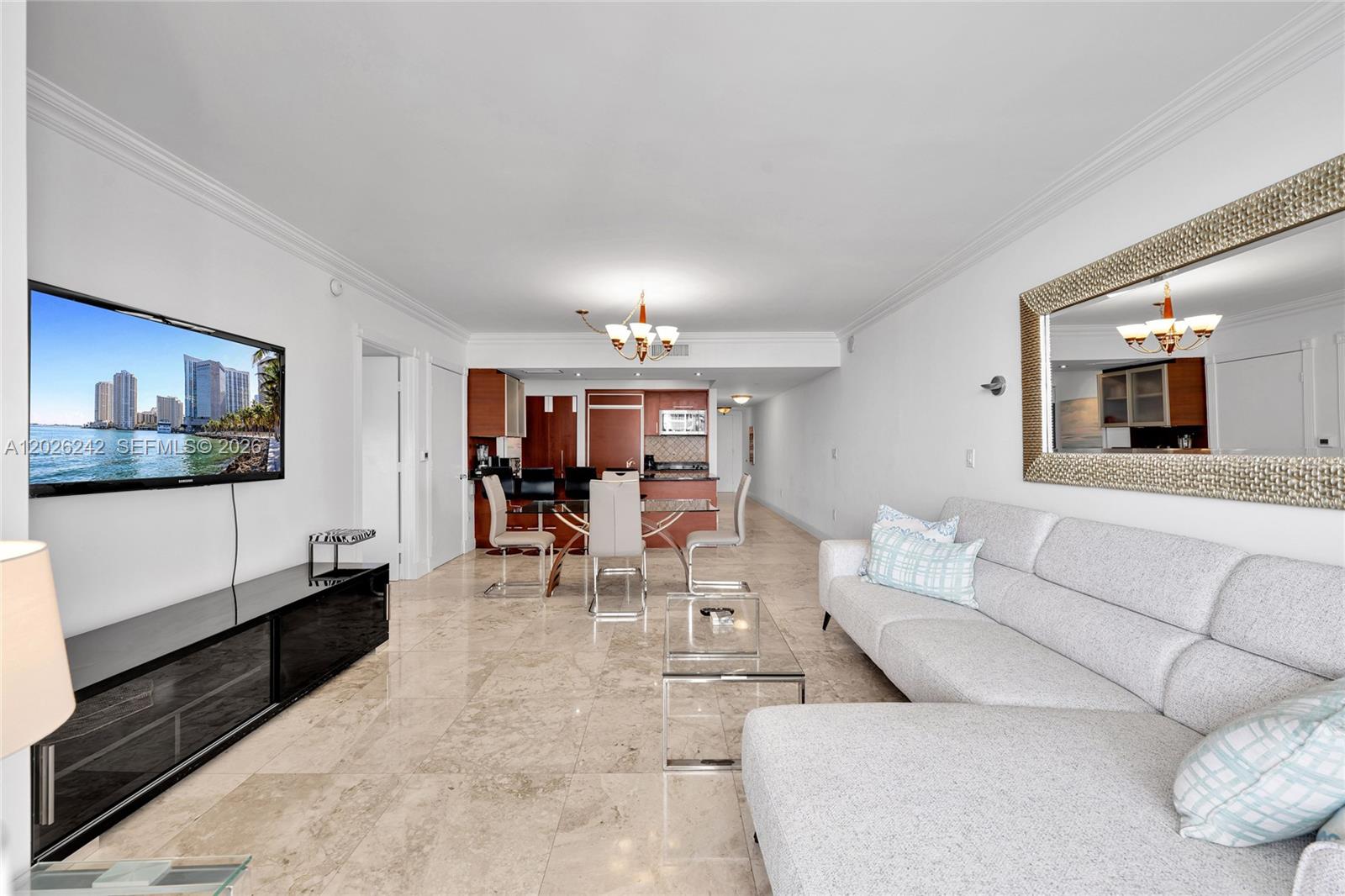 A living and dining area features marble floors, a sectional sofa, and a kitchen — 1830 S OCEAN DR # 3310, Hallandale Beach FL 33009, HALLANDALE BEACH, FL