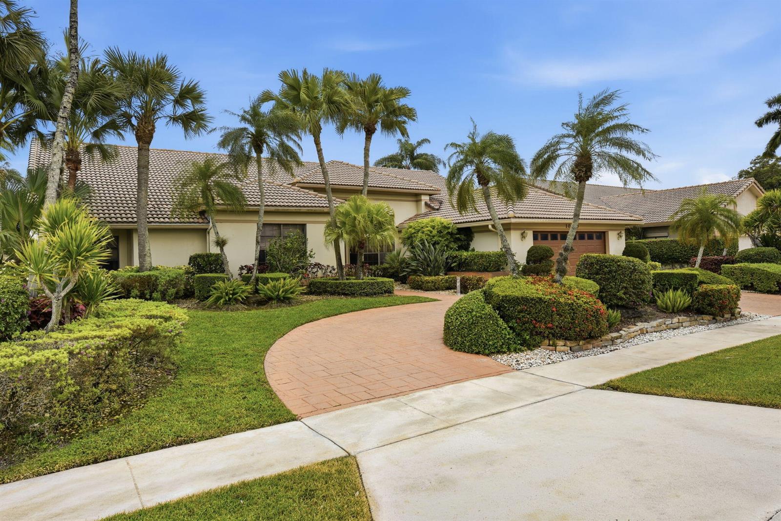 A single-story house with a tiled roof, palm trees, and a paved driveway — 10330 Silver Lake Drive, Boca Raton FL 33428, BOCA RATON, FL