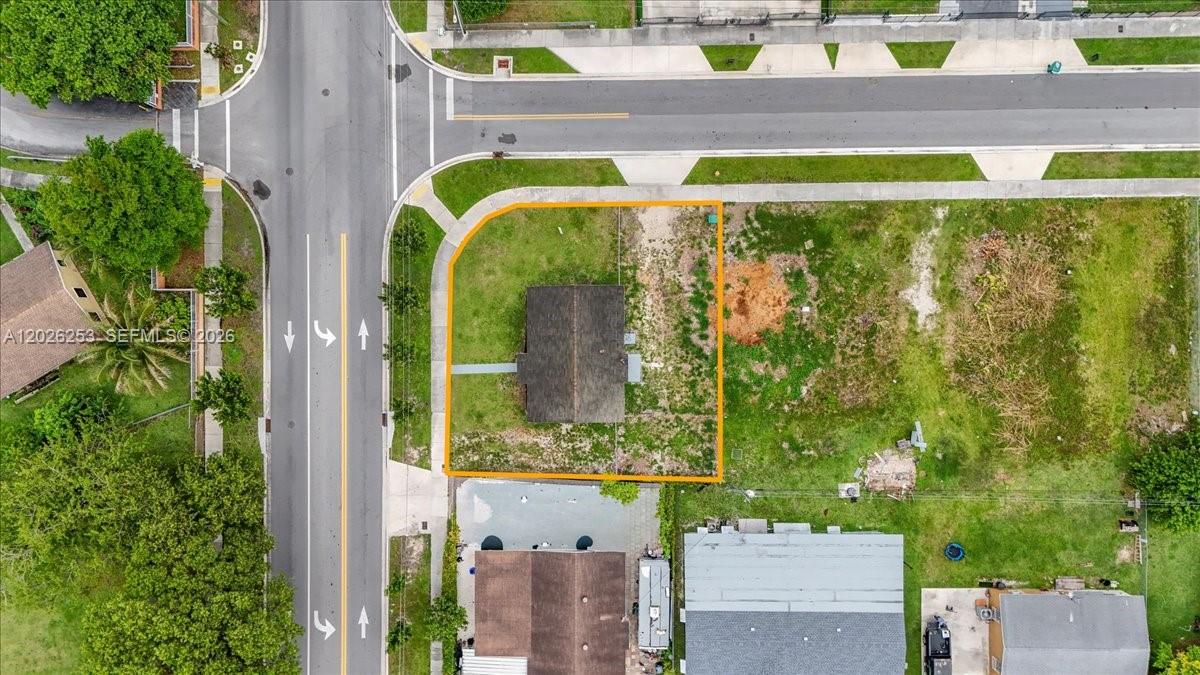 An aerial view shows a small house on a corner lot with surrounding grass — 813 NW 6th Ave, Florida City FL 33034, FLORIDA CITY, FL