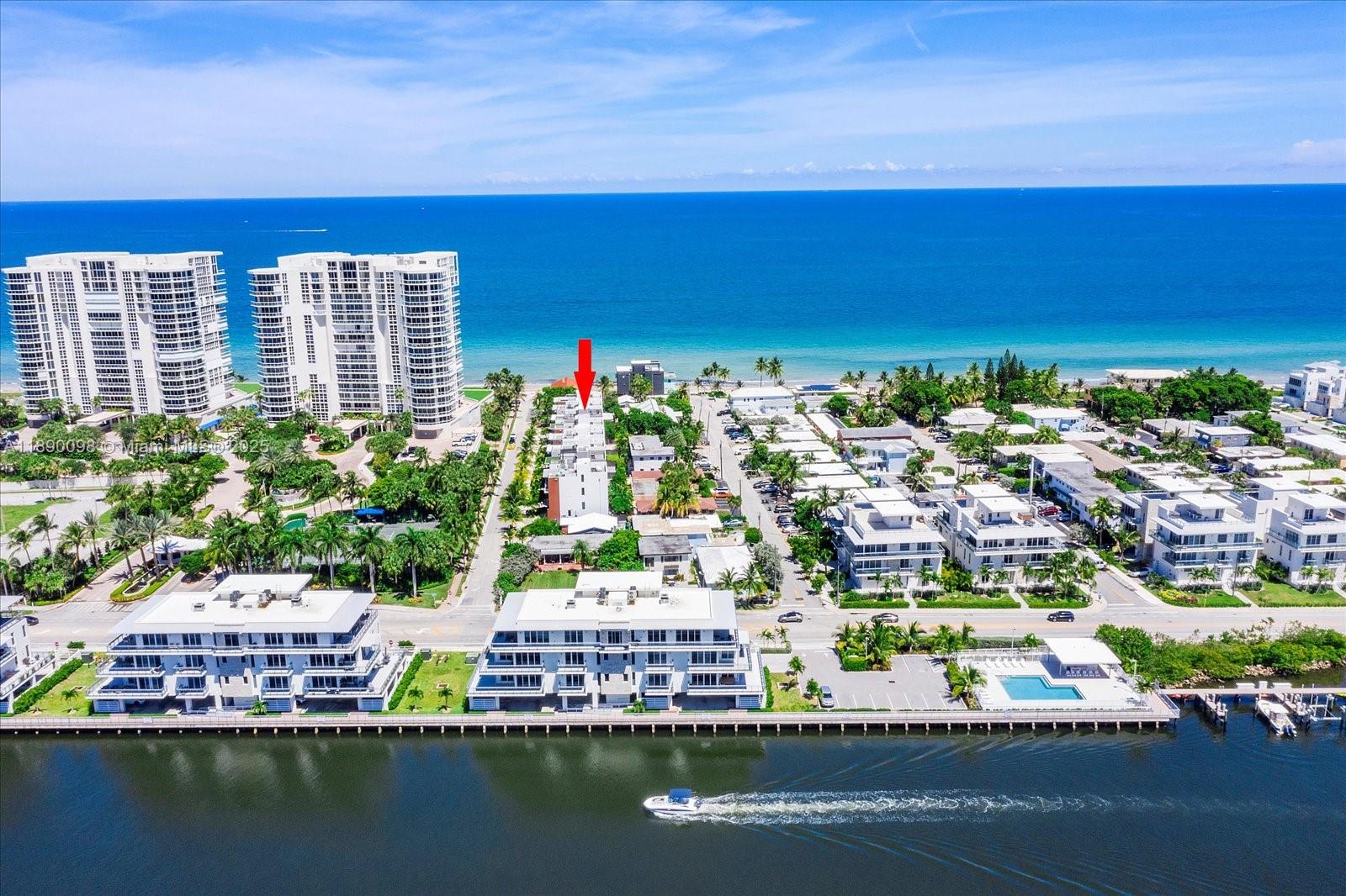 An aerial view shows a multi-story residential building marked by a red arrow near the ocean — 332 Balboa St, Hollywood FL 33019, HOLLYWOOD, FL