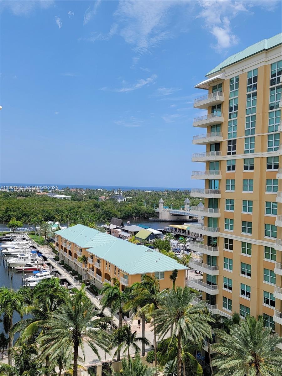 An elevated view shows a marina, a drawbridge, and a tall residential building under blue skies — 700 E Boynton Beach Blvd # 1007, Boynton Beach FL 33435, BOYNTON BEACH, FL