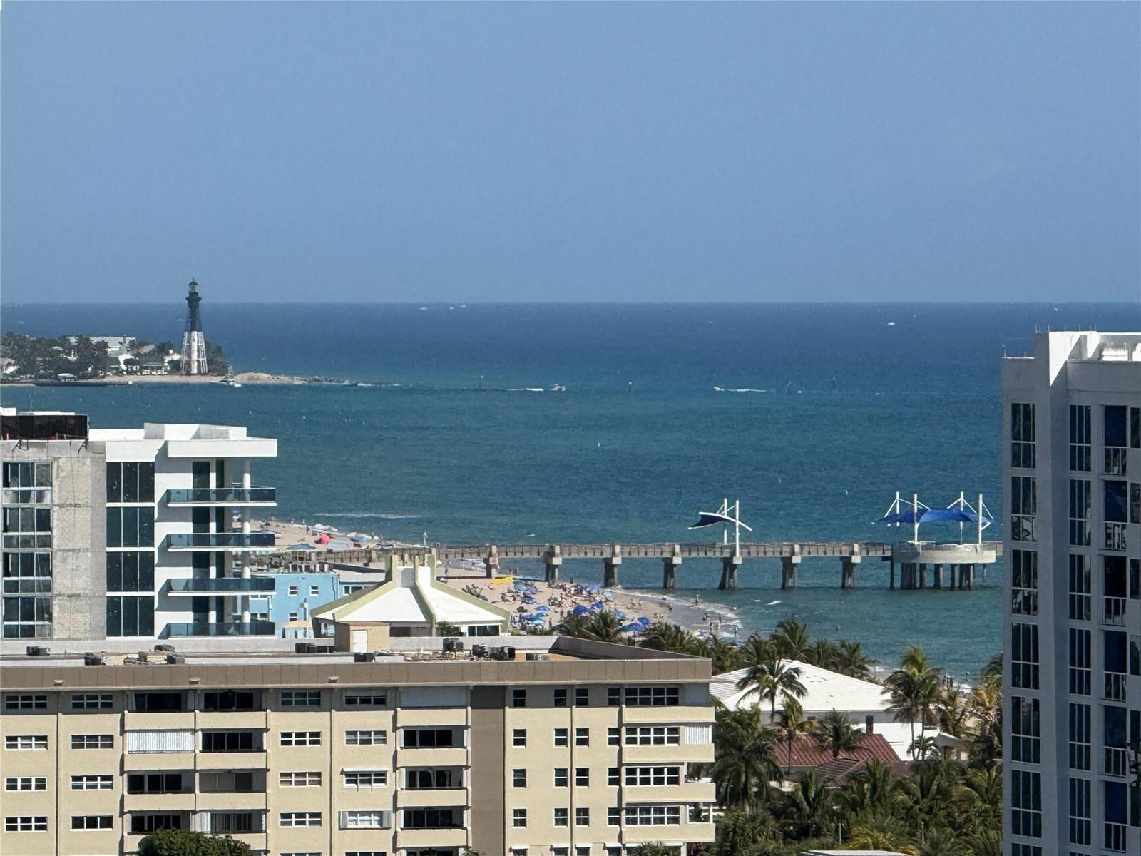 An elevated view of a beach, a pier, and a lighthouse overlooking the ocean — 1200 Hibiscus Avenue, Pompano Beach FL 33062, POMPANO BEACH, FL