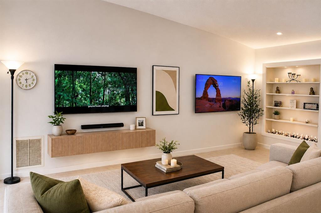 A living room features tile flooring, a large sectional sofa, and two wall-mounted televisions — 2008 HOUNDSLAKE DRIVE, WINTER PARK, FL