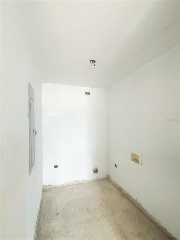 An unfinished utility room with white walls, a concrete floor, and exposed electrical and plumbing connections — 550 AVE FERNANDEZ JUNCOS UNIT 1208, SAN JUAN, PR