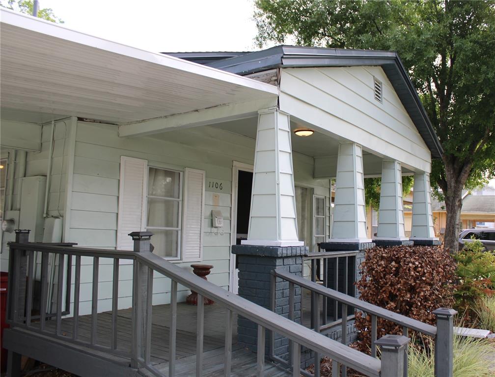 A light green house with a front porch, tapered columns, and a wooden wheelchair ramp — 1106 E DR MARTIN LUTHER KING JR BOULEVARD, PLANT CITY, FL