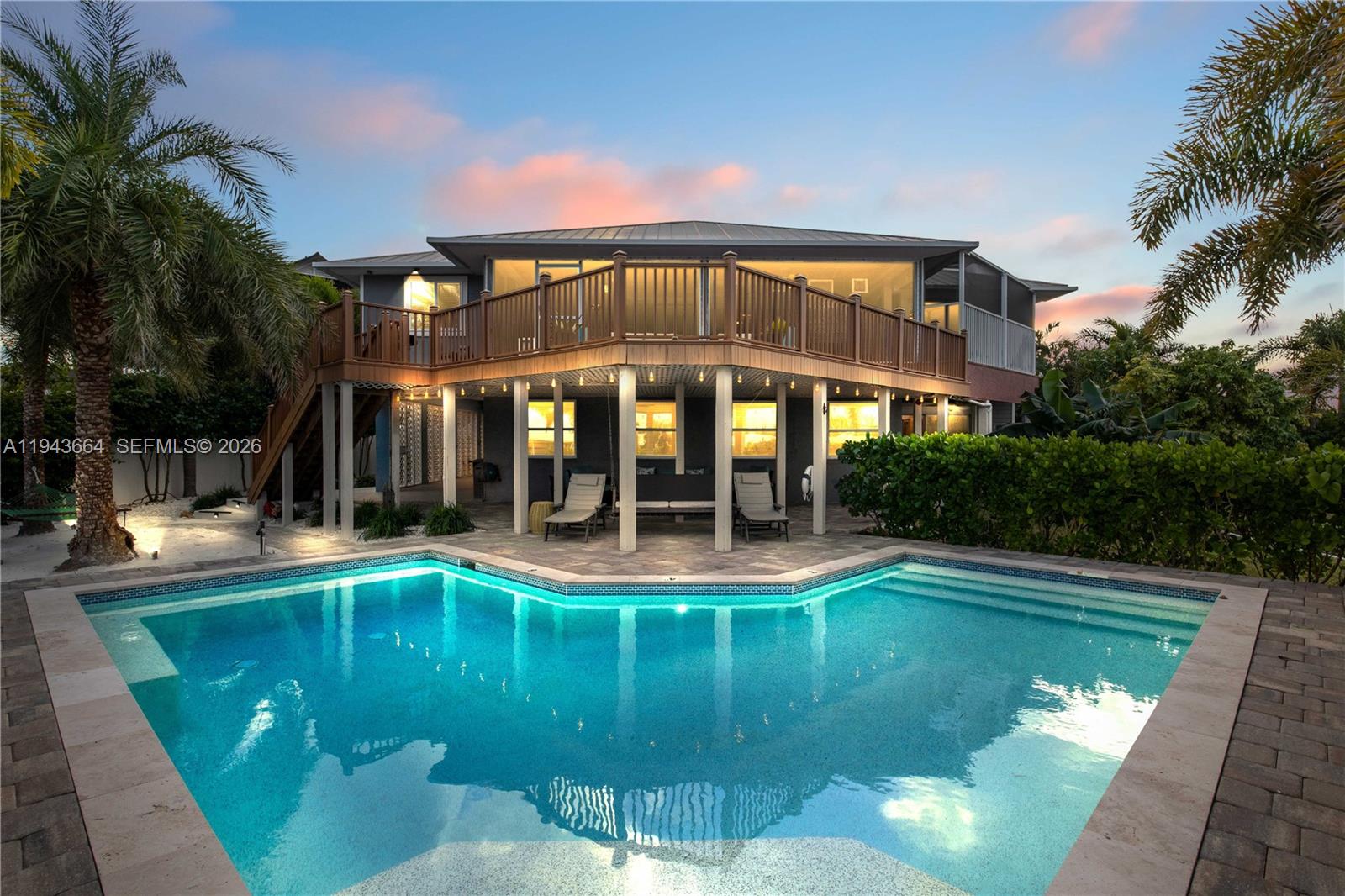 A two-story house with a large wooden deck overlooking a backyard swimming pool — OTHER CITY - IN THE STATE OF FLORIDA, FL