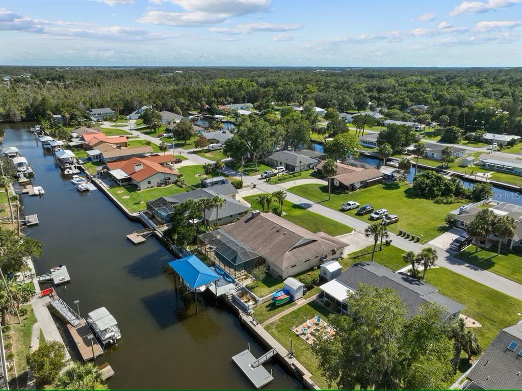 An aerial view shows waterfront houses with private docks along a canal in Florida — 3945 N TIMUCUA POINT, CRYSTAL RIVER, FL