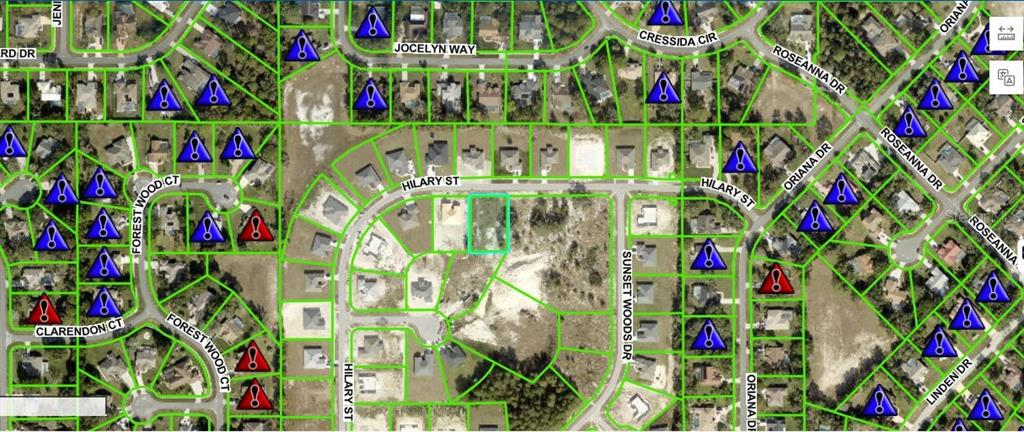 This is a map showing a vacant residential lot highlighted in blue among existing homes — HILARY STREET, SPRING HILL, FL