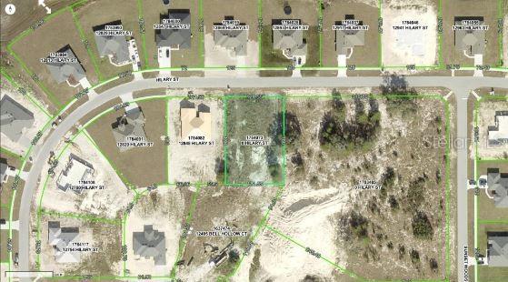 This aerial map shows a vacant residential lot highlighted in green within a suburban neighborhood — HILARY STREET, SPRING HILL, FL