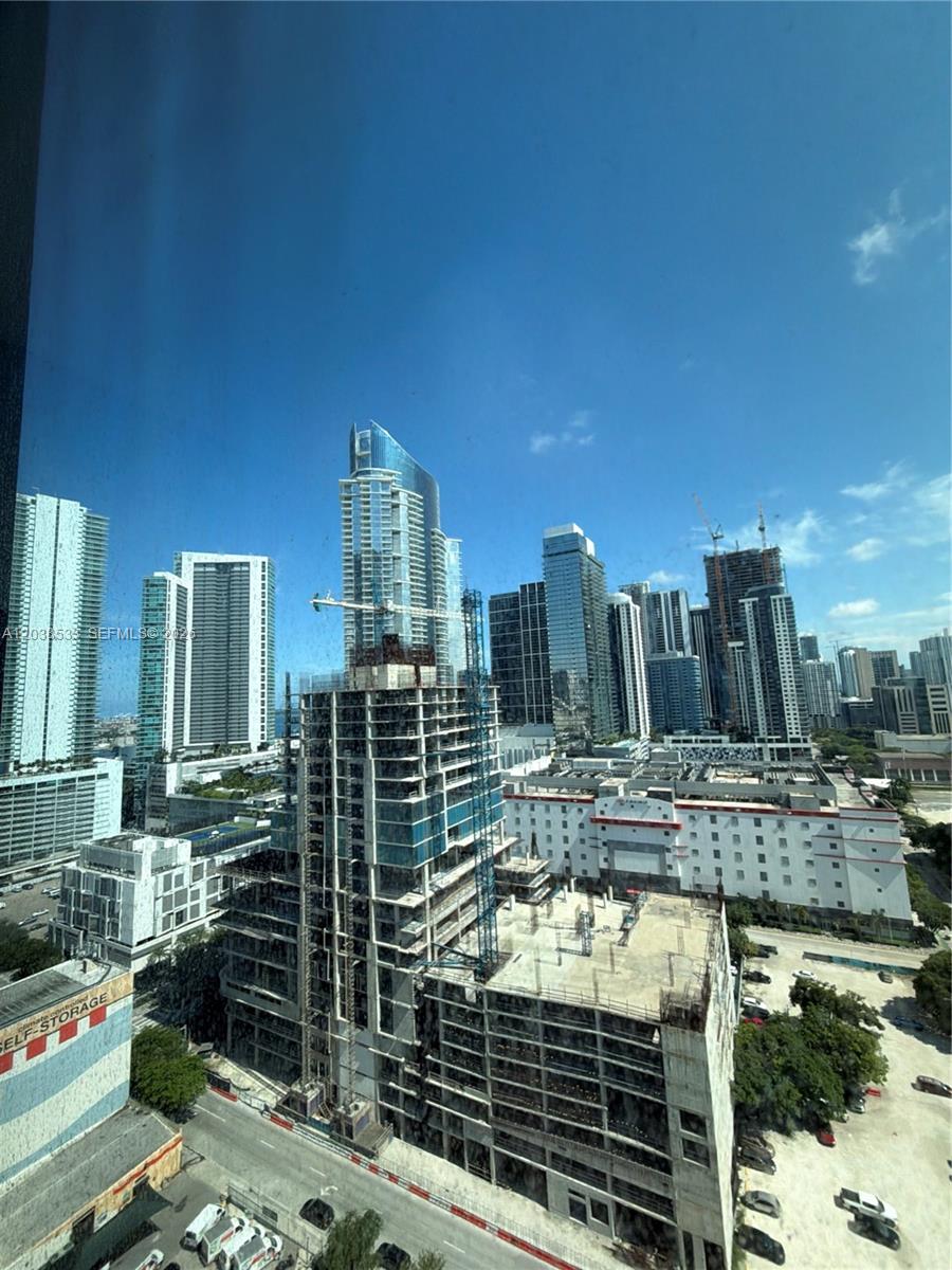 An elevated view of a city skyline featuring several high-rise buildings and active construction sites — 20 NE 11th st # 5305, Miami FL 33132, MIAMI, FL