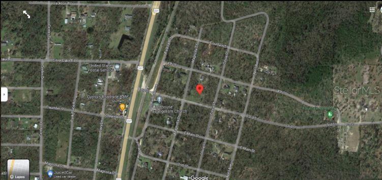 This is a satellite map view showing a red location pin on a residential lot — 12307 3RD STREET, FOUNTAIN, FL