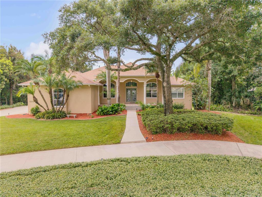 5842 SPRUCE CREEK WOODS DRIVE